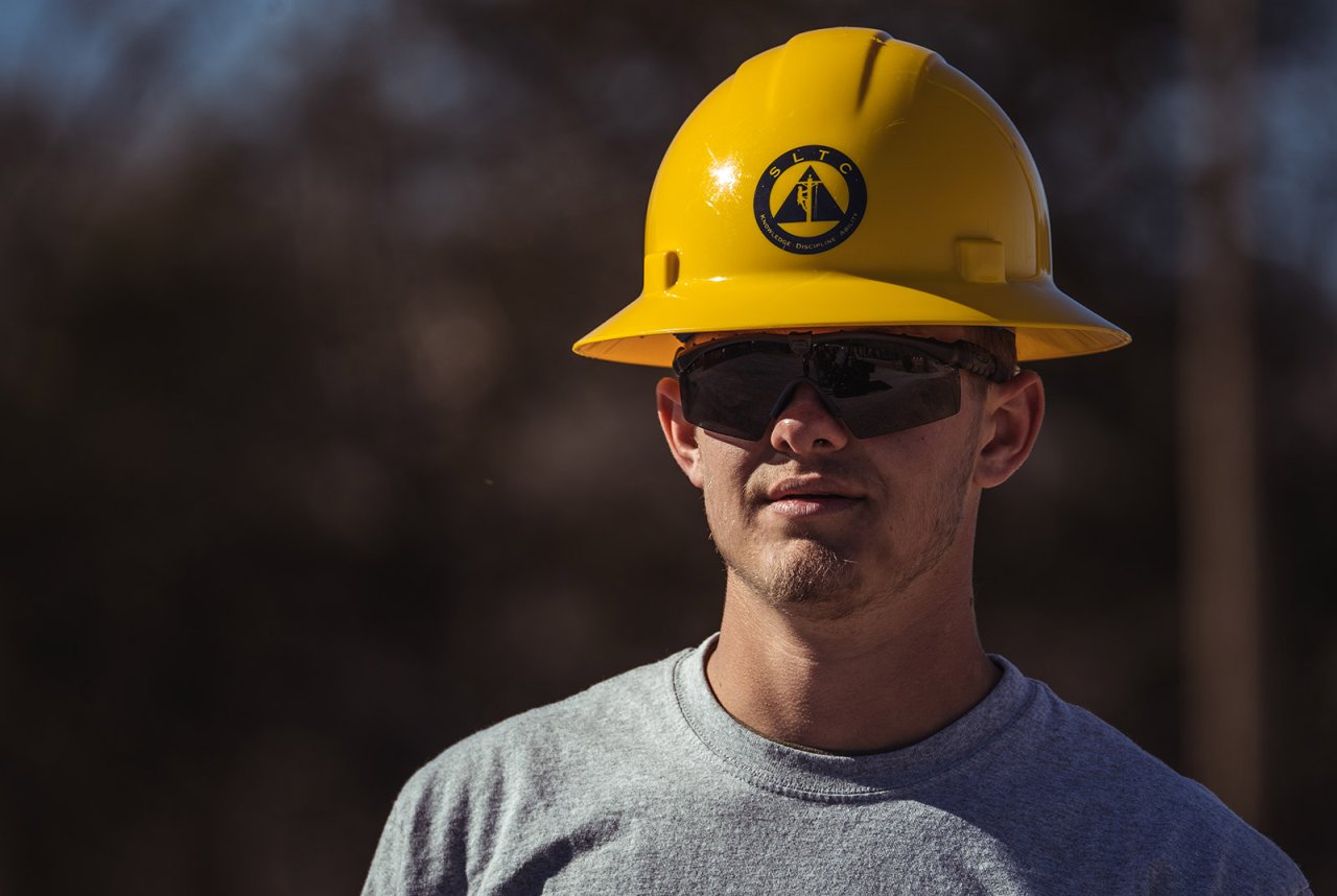 Student wearing Hardhat and Safety Glasses.